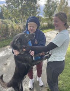 Two Women Meeting An Alaskan Husky in Fairbanks Alaska.
