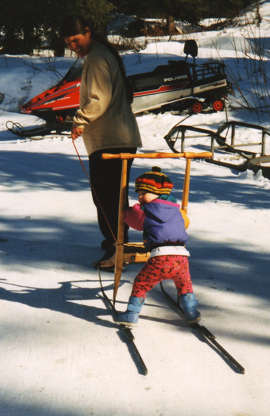 Susan Butcher Pulls Baby Tekla Monson On Dog Sled